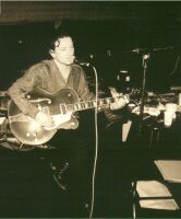 Bono playing guitar