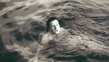 Bono swimming